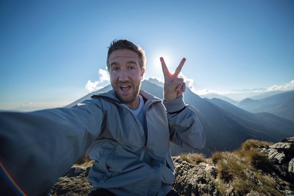 man taking selfie on mountain