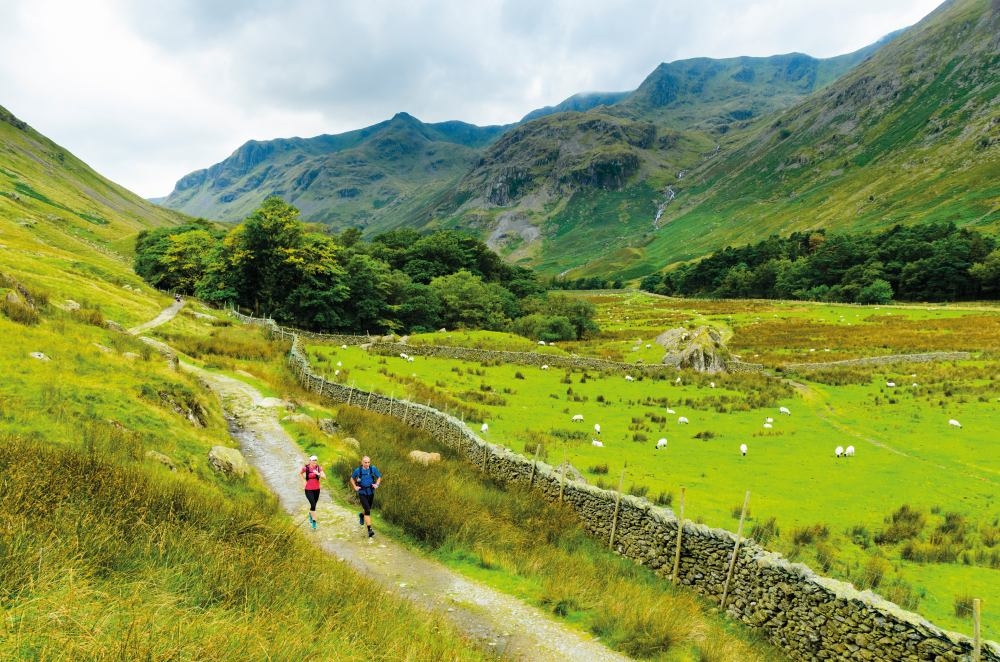 running down grisedale with the crags of dollywaggon pike and nethermost pike behind jon sparks