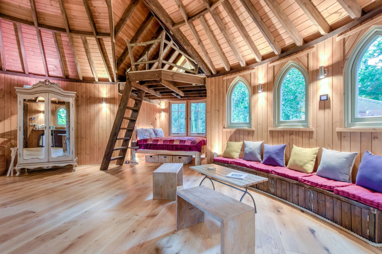 Wooden well-decorated living room in Narnia treehouse - Cedar Hollow Treehouse, Oxford, England