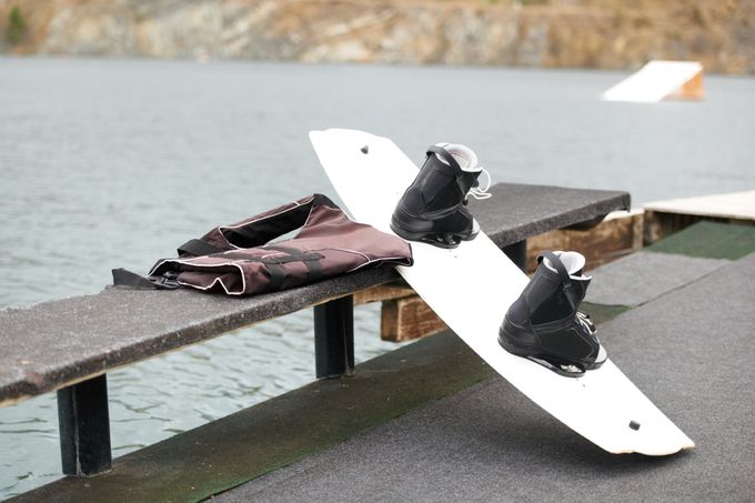 Cropped view of a wakeboard alongside the lake