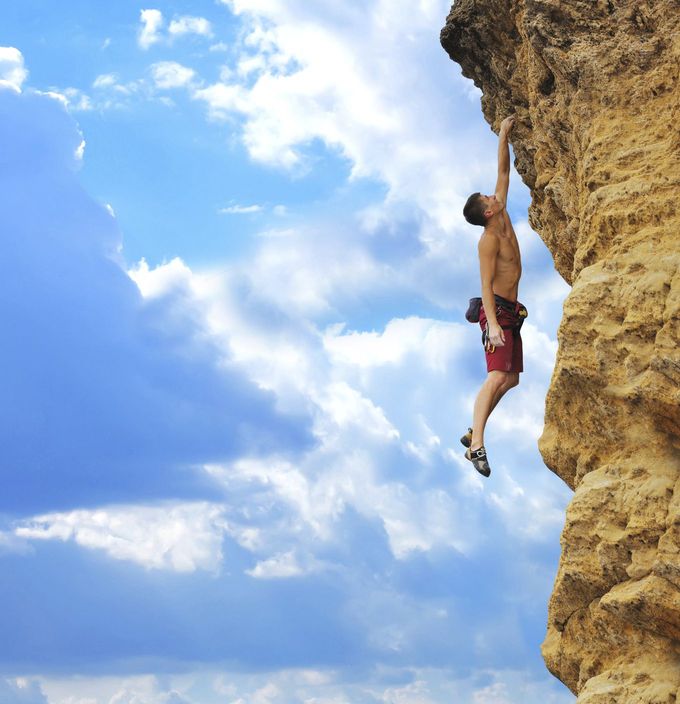A man free solo rock climbing