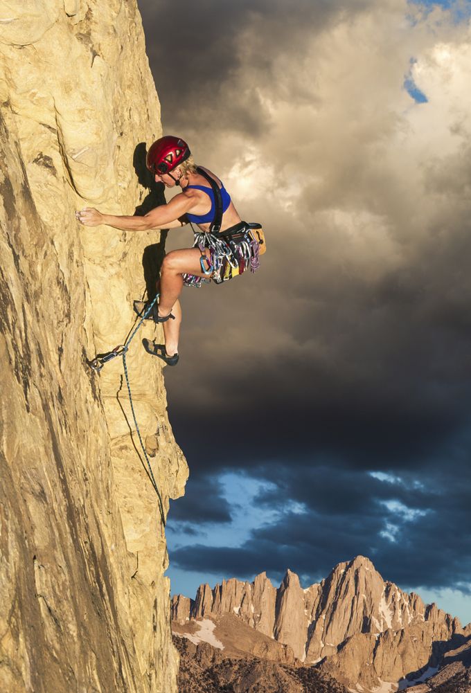 A woman sport climbing / rock climbing