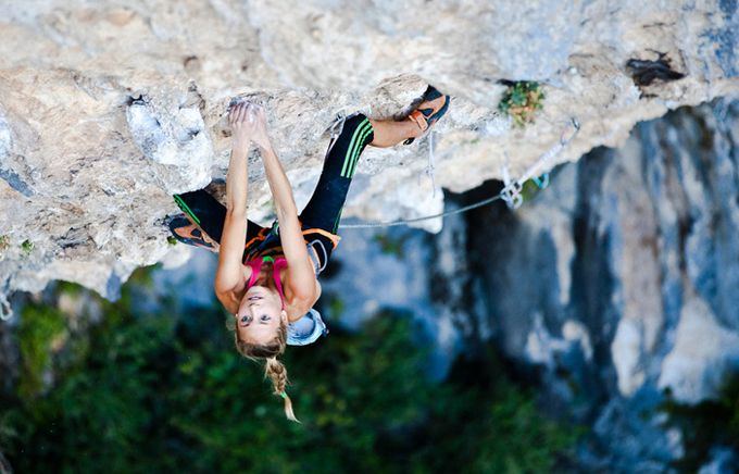 A woman rock climbing 