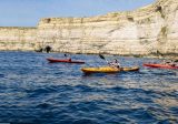 kayakers heading out to sea