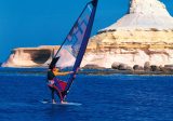 windsurfer against stunning scenery