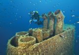 diver explores underwater funnel