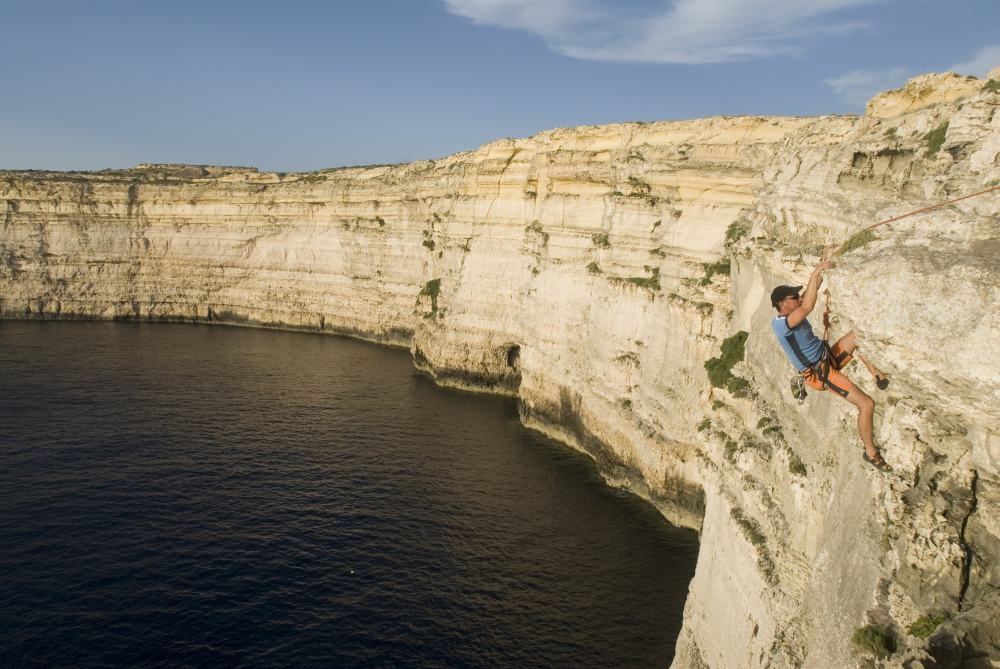 high abseiling above sea