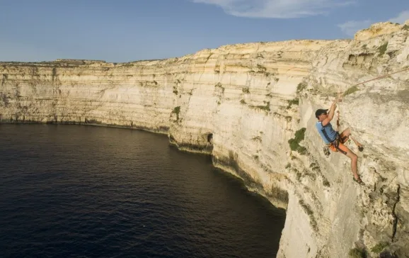 high abseiling above sea