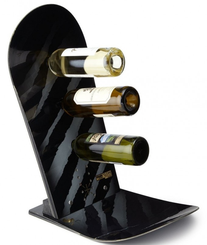A battered old snowboard becomes one of those fancy gravity-defying wine holders
