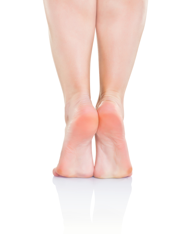 A woman's bare feet standing on tip toes