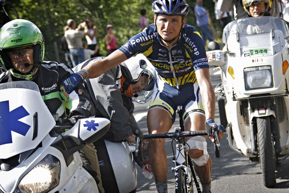Johnny Hoogerland Tour de France crash barbed wire 2011 car