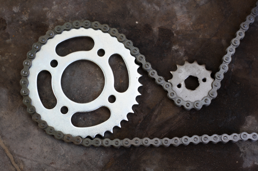 Metal chain and cog wheel.