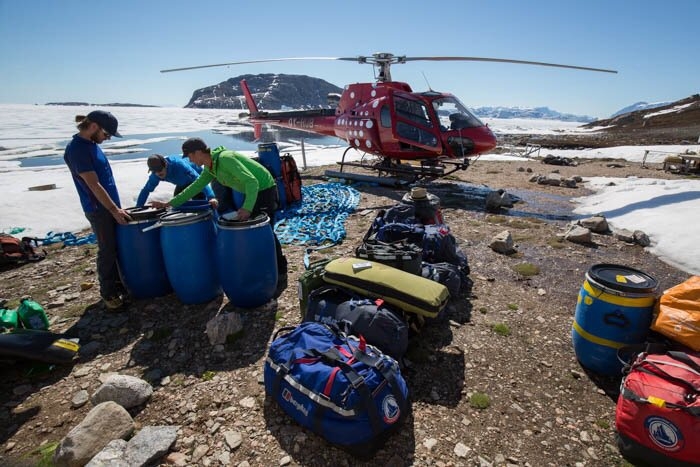 joe matt pickles and leo repacking gear at the depot ready for it to be cached in 3 different positions pack raft store wall basecamp and top of glacier