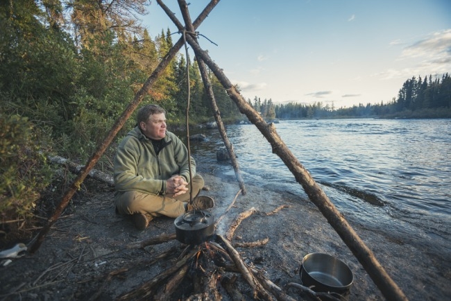 ray sitting by campfire web