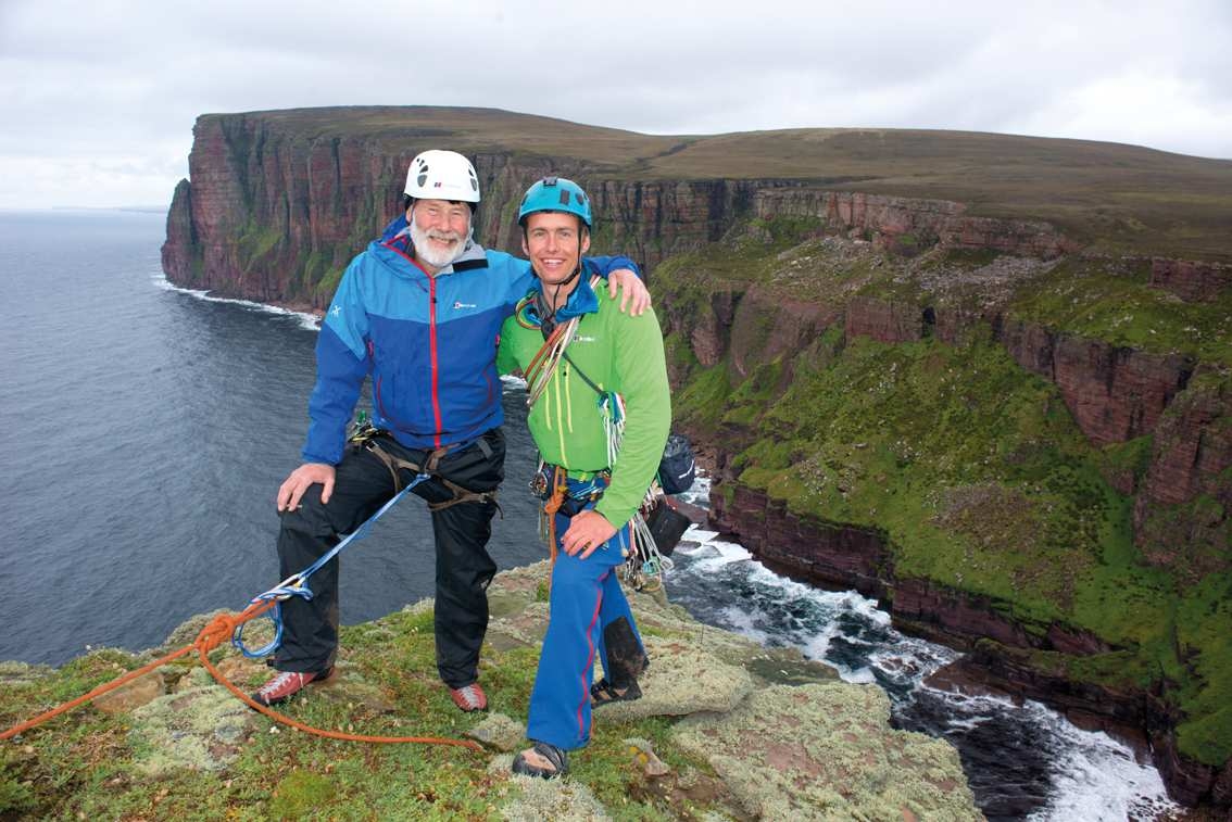 sir chris bonington and leo houlding on the summit of the old man of hoy