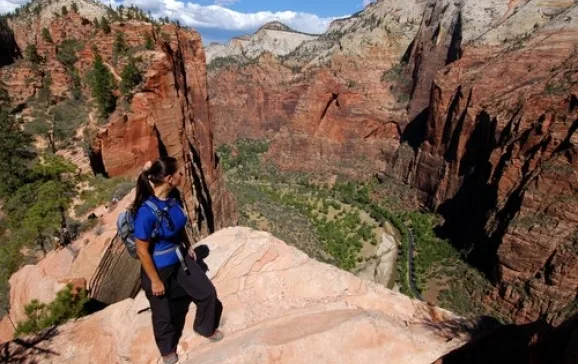 1461 woman hiking angels landing in zion national park credit shutterstock