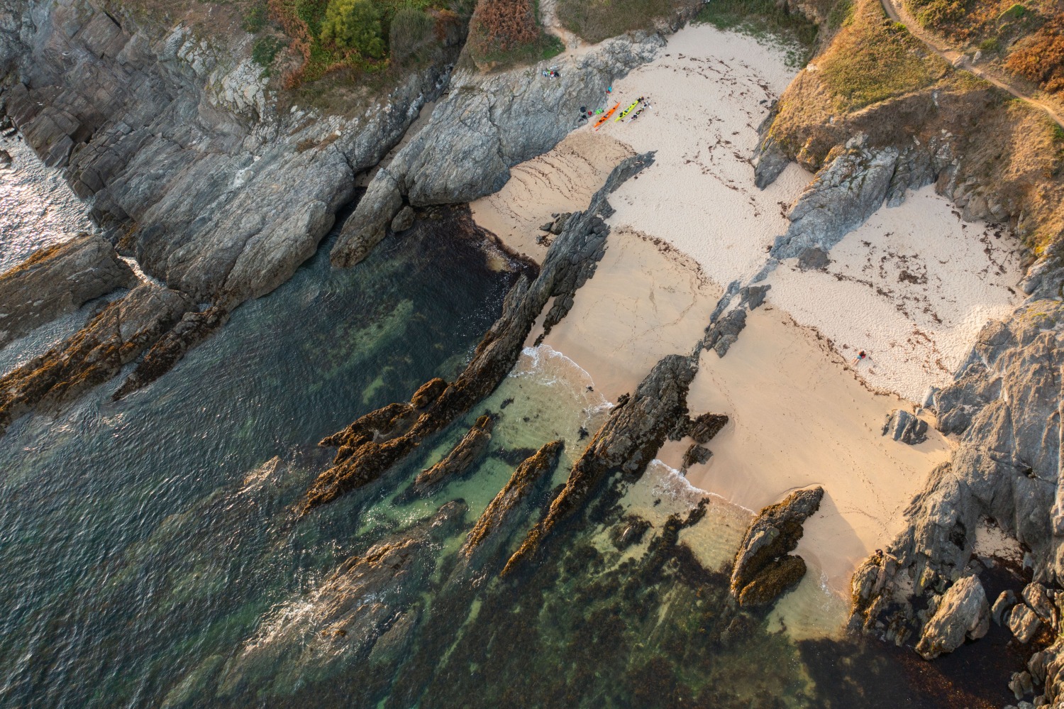 Birds eye view of sandy cove with rocks - Brittany, France