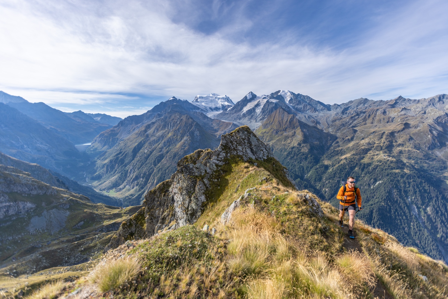 Man running along mountainous ridge