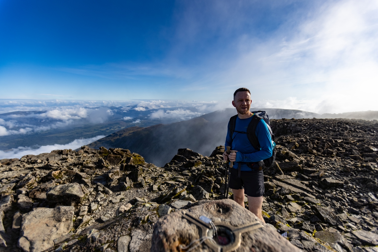 Shot of climbing looking at rocky slopes of Ben Nevis with mountains in background