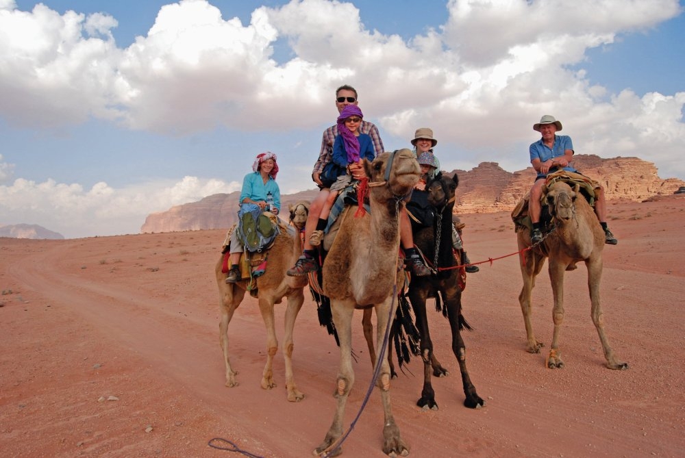 all the family on camels in wadi rum