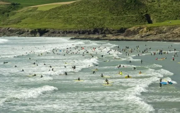 1821 surfers polzeath beach cornwall credit david hughes