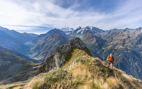 Man running along mountainous ridge Verbier Active Adventure CREDIT  Dave MacFarlane