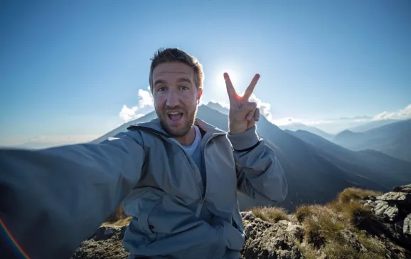 man taking selfie on mountain