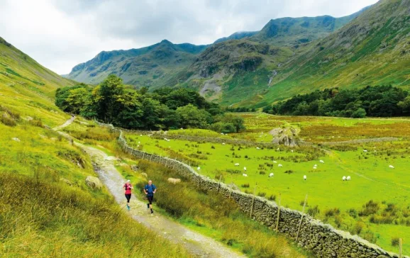 running down grisedale with the crags of dollywaggon pike and nethermost pike behind jon sparks