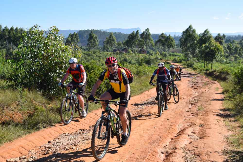 Matt and his cycling companions on the dirt roaxd to Lake Sahambav.JPG