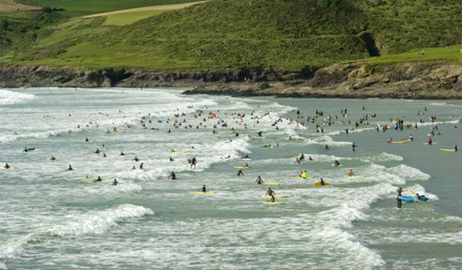 surfers Polzeath beach cornwall CREDIT David Hughes