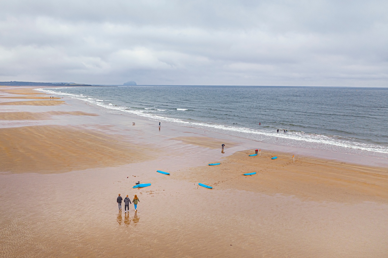 People and surfboards on Belhaven beach, East Lothian
