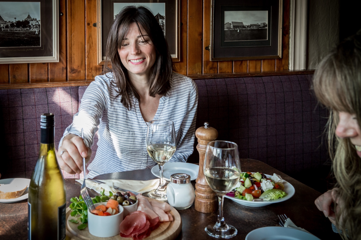 Woman eating from meat platter - Old Clubhouse, East Lothian