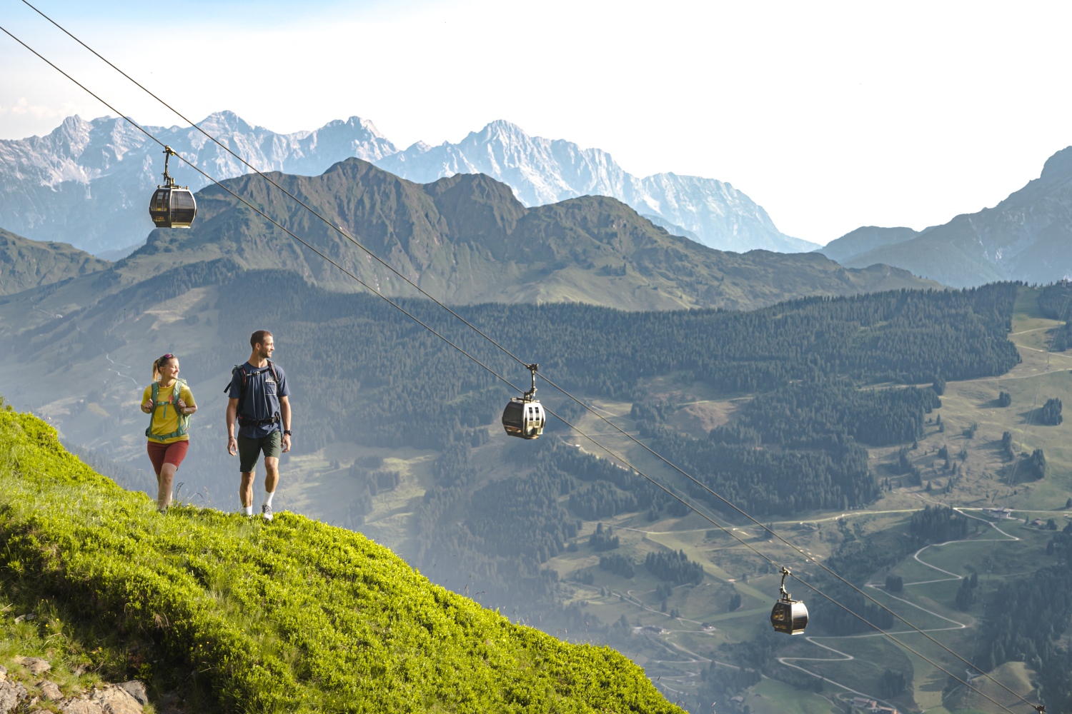 people-overlooking-mountains-austrian-alps
